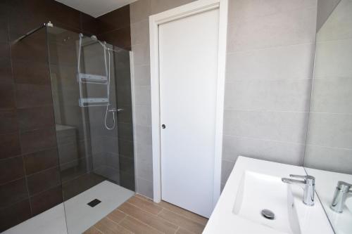 a bathroom with a sink and a shower at 5056 Apartamento Nuba Javea in Jávea