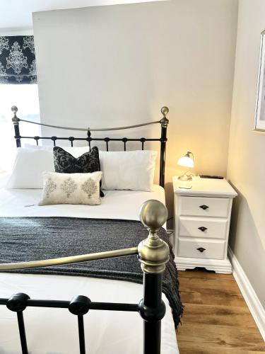 Ένα ή περισσότερα κρεβάτια σε δωμάτιο στο Devon House Guest House
