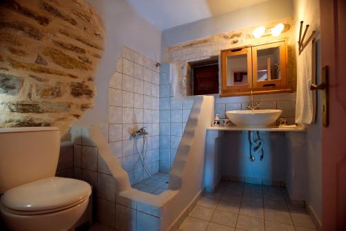 a bathroom with a sink and a toilet at Benos Tower in Tsikkaliá
