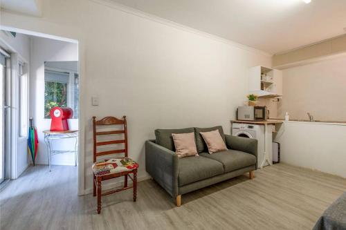 a living room with a couch and a chair at Gawler Townhouses 1a in Gawler