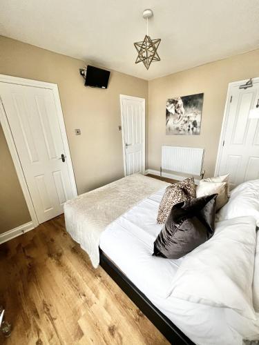 Ένα ή περισσότερα κρεβάτια σε δωμάτιο στο Devon House Guest House