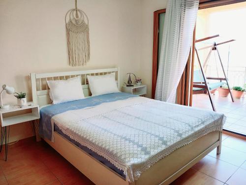 Postel nebo postele na pokoji v ubytování Villa Maria Rosa - - Koutsoubri Beach Evia