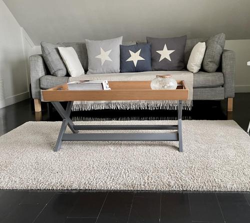 A seating area at Stylish loft apartment moments from beach by Whitstable-Holidays, Bowline