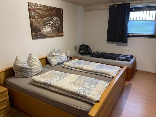 Postel nebo postele na pokoji v ubytování Monteurwohnung - FerienWohnung nähe Limburg an der Lahn