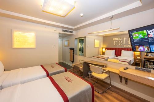 a room with two beds and a tv in it at Ramada By Wyndham Istanbul Pera Taksim in Istanbul