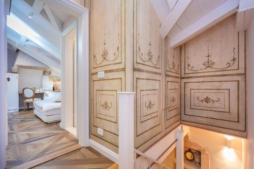 a hallway with wood paneled walls and a living room at St. Joseph's in Dubrovnik