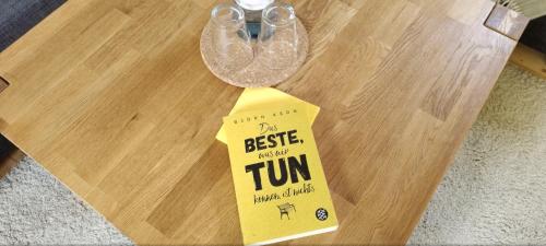 a table with a book prize on top of it at Bed and Breakfast Wehlen in Stadt Wehlen
