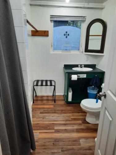a bathroom with a sink and a toilet at C&N Backpackers - Ucluelet in Ucluelet