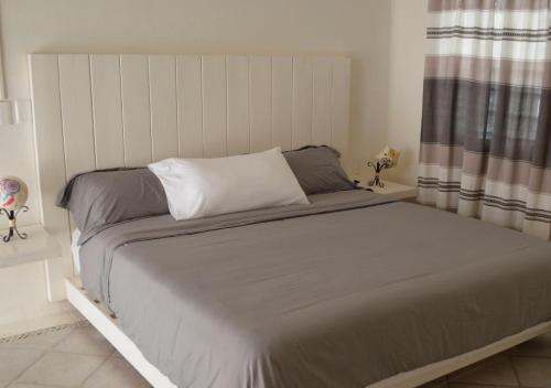 Ένα ή περισσότερα κρεβάτια σε δωμάτιο στο Alto de la Sierra Villa Huatulco by Rotamundos