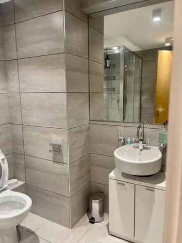 a bathroom with a sink and a toilet at Monument Prime Location in the City of London in London