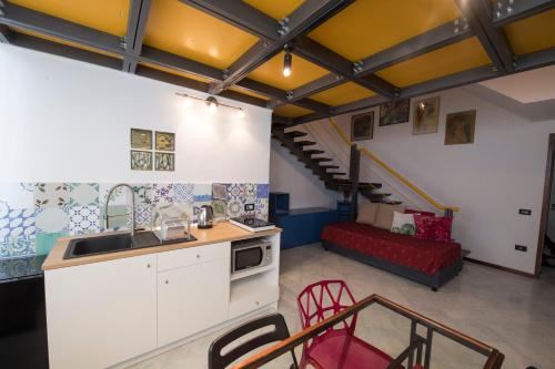 Η κουζίνα ή μικρή κουζίνα στο Duplex con vista Vesuvio