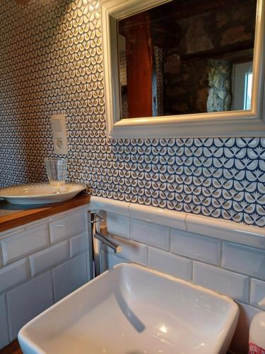a bathroom with a sink and a mirror at Maison d'Engon charme nature in Beauraing