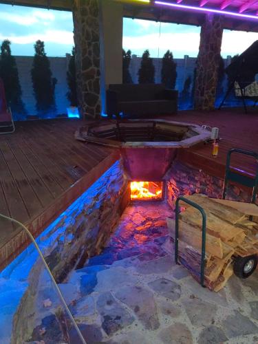 a hot tub on the deck of a house at Villa Melissa in Vyšné Nemecké