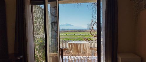 an open door to a patio with a table and a view at Marko Apartments in Struga
