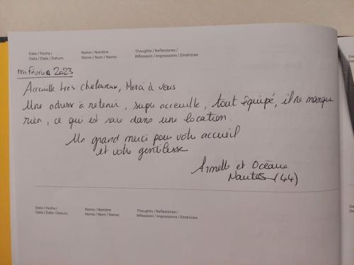a piece of white paper with writing on it at Gîte Kerlosvézan, à la campagne, proche mer in Lampaul-Ploudalmézeau