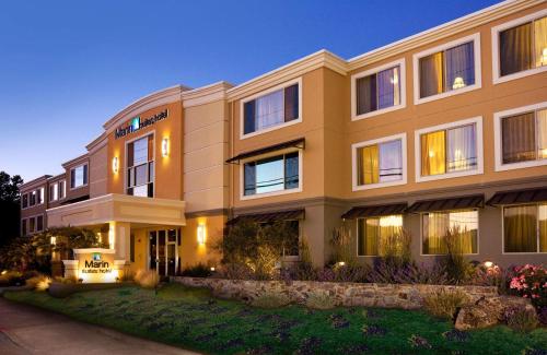 a rendering of a building at night at Marin Suites Hotel in Corte Madera
