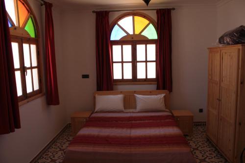 Llit o llits en una habitació de Riad Kebdana