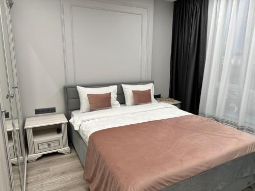 Katil atau katil-katil dalam bilik di APARTMENT DELUX