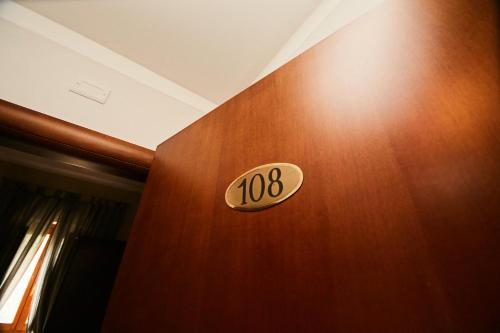 a wooden door with the number on it at HOTEL VULCI in Montalto di Castro