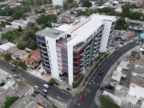 an aerial view of a building in a city at Wabi Salvi Apartment-A senses experience. in San Salvador