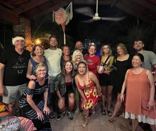 a group of people posing for a picture at a party at Hacienda La Rusa in Barra de Potosi