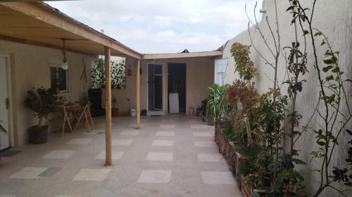 an empty patio with plants in a house at شقة المنظر الجميل in Midelt