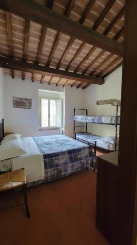 Ένα ή περισσότερα κρεβάτια σε δωμάτιο στο Locanda Francescana