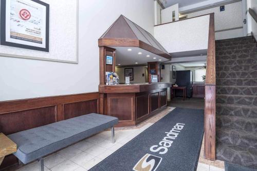 a fast food restaurant with a bench and a counter at Sandman Inn Smithers in Smithers