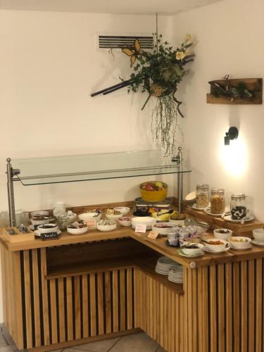 a buffet with many different types of food on a table at Waldpension Jägerstüberl in Bad Griesbach