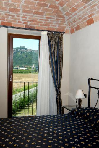 Postel nebo postele na pokoji v ubytování Hotel Le Botti