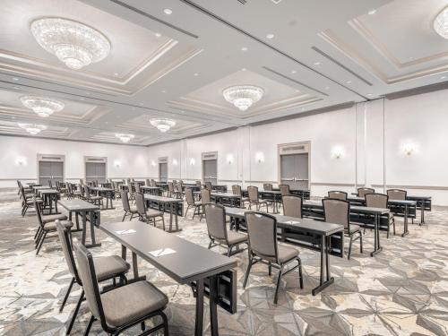 a large room with tables and chairs in it at Crowne Plaza College Park - Washington DC by IHG in Greenbelt