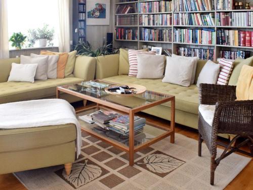 a living room with a couch and a coffee table at 9 person holiday home in NESØYA-By Traum in Sandvika