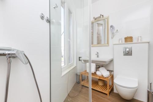 a bathroom with a toilet and a sink at Spalatum Boutique Suites in Split