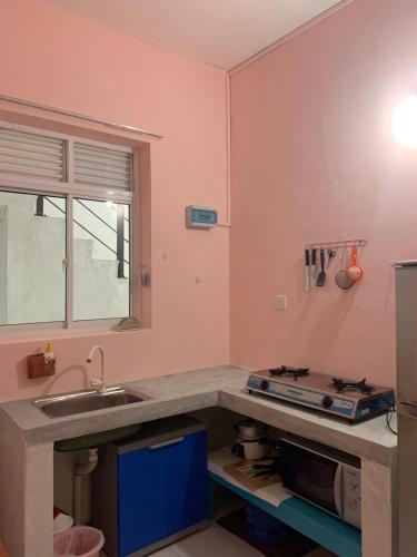 a kitchen with a sink and a counter top at Araliya Suite in Nugegoda