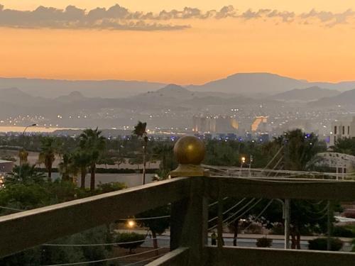 a view of a city at sunset from a balcony at Galaxy Apartments in Aqaba