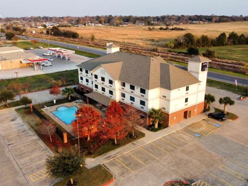 an overhead view of a building with a pool at Franklin Inn & Suites in Franklin