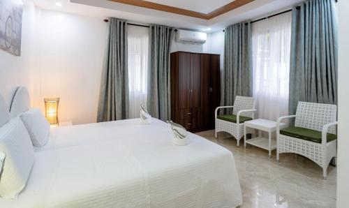 Кровать или кровати в номере MADISON GARDEN AND RESIDENCES