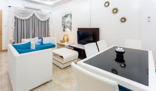 Кровать или кровати в номере MADISON GARDEN AND RESIDENCES