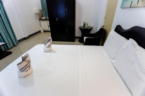 Кровать или кровати в номере MADISON GARDEN AND RESIDENCES