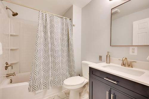 a bathroom with a sink toilet and a shower curtain at Deck and Grill Convenient Home in Hummelstown in Hummelstown