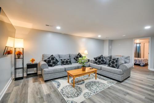 a living room with two couches and a table at Deck and Grill Convenient Home in Hummelstown in Hummelstown