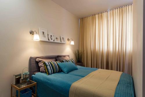 Ένα ή περισσότερα κρεβάτια σε δωμάτιο στο Raugyklos apartamentai