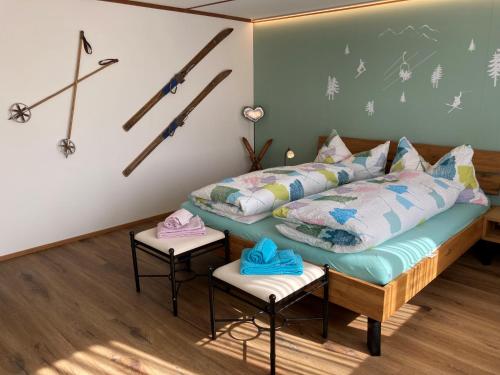a bedroom with a bed with skis on the wall at Chalet Aloa in Adelboden