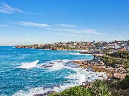 an aerial view of a beach with the ocean at Oceanfront Tamarama Apartment: Best View in Sydney in Sydney