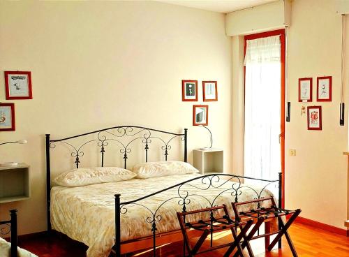Postel nebo postele na pokoji v ubytování B&B L'Assiolo