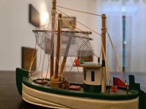 a small model of a boat sitting on a table at LaMarina in Camogli