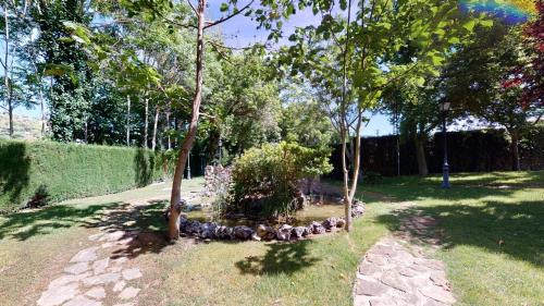 a garden with a bunch of trees in a yard at Huerta de las Palomas in Priego de Córdoba