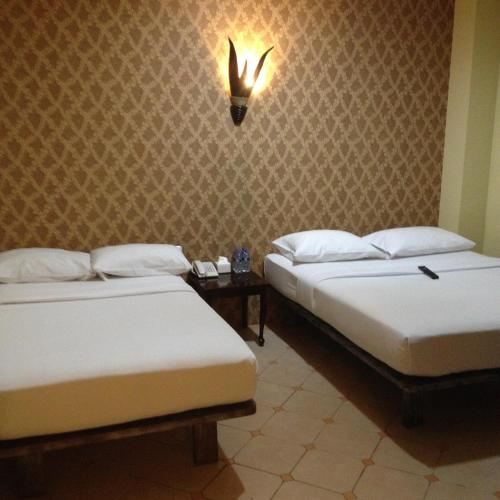 Twins Hotelにあるベッド