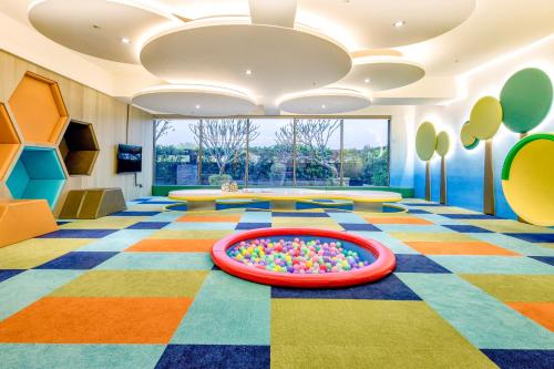 a room with a pool of balls on the floor at Hsin Hotel in Chiayi City