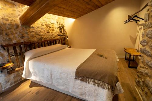 Katil atau katil-katil dalam bilik di Casa Sanui. Apartaments turístics rurals